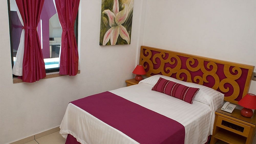 Imagen de la habitación del Hotel Boutique Pueblo Lindo. Foto 9