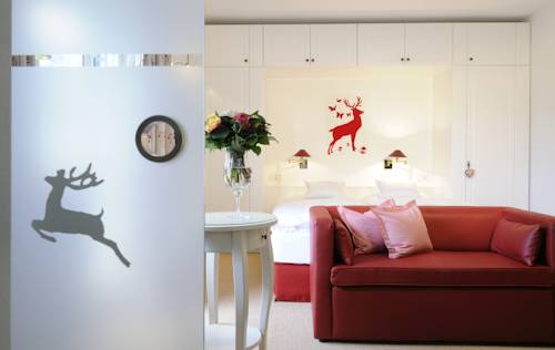 Imagen de la habitación del Hotel Boutique Relais Chalet Wilhelmy. Foto 13