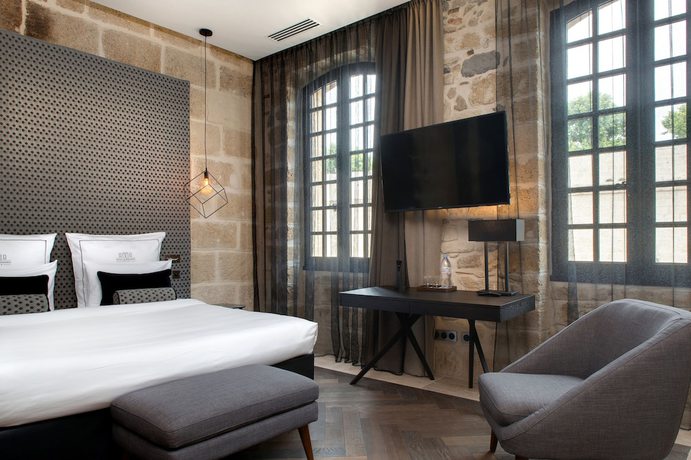 Imagen de la habitación del Hotel Boutique des Remparts. Foto 7