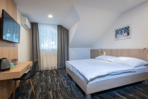 Imagen de la habitación del Hotel Boutique hotel Vila Efekt. Foto 17