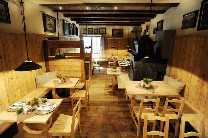 Imagen del bar/restaurante del Hotel Boutiquehotel Weisses R&ouml;ssl. Foto 2