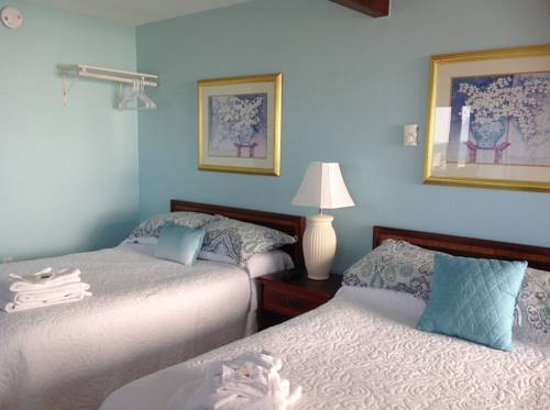 Imagen de la habitación del Hotel Breakers By The Sea. Foto 11