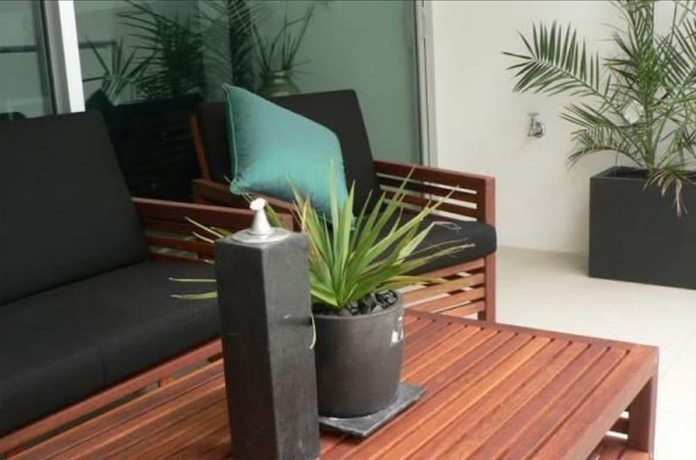 Imagen de la habitación del Hotel Breeze Beachfront Apartments. Foto 16