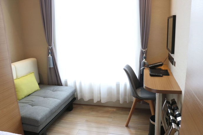 Imagen de la habitación del Hotel Bridal Tea House Yantai Zhifu. Foto 7