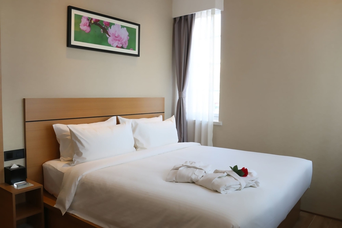 Imagen de la habitación del Hotel Bridal Tea House Yantai Zhifu. Foto 9