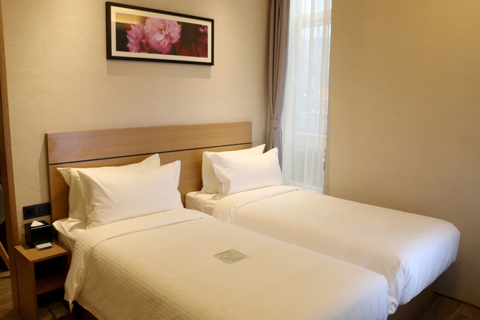 Imagen de la habitación del Hotel Bridal Tea House Yantai Zhifu. Foto 10