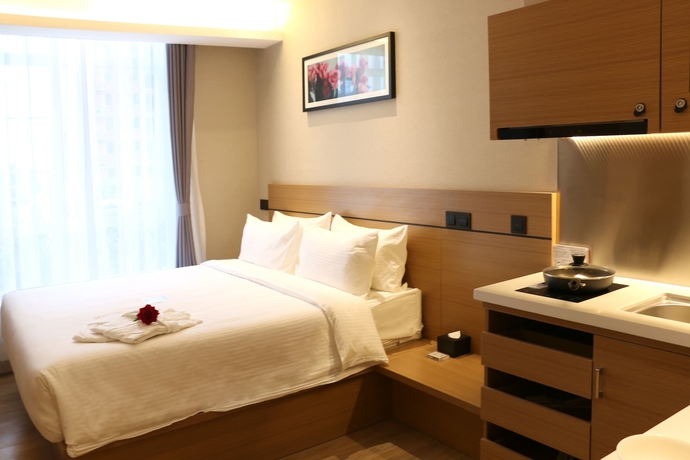 Imagen de la habitación del Hotel Bridal Tea House Yantai Zhifu. Foto 11