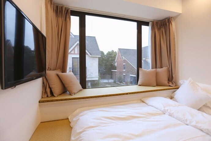 Imagen de la habitación del Hotel Bright House Shanghai Disney Branch. Foto 27