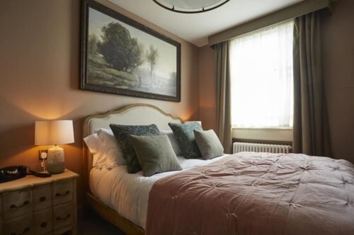 Imagen de la habitación del Hotel Broadstreet Townhouse. Foto 15