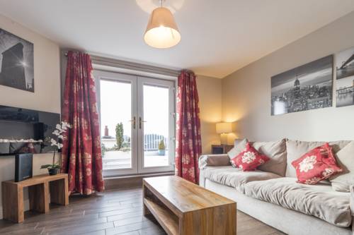 Imagen de la habitación del Hotel Broc House Suites. Foto 11