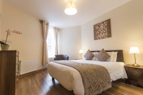 Imagen de la habitación del Hotel Broc House Suites. Foto 15