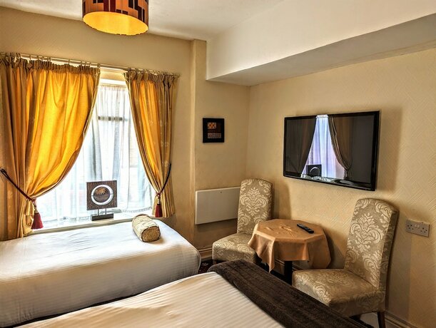 Imagen de la habitación del Hotel Brookside. Foto 19