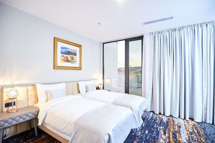 Imagen de la habitación del Hotel Brosse Garden. Foto 18