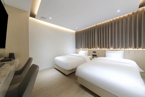 Imagen de la habitación del Hotel Brown Dot Pyeonghwa plaza. Foto 14