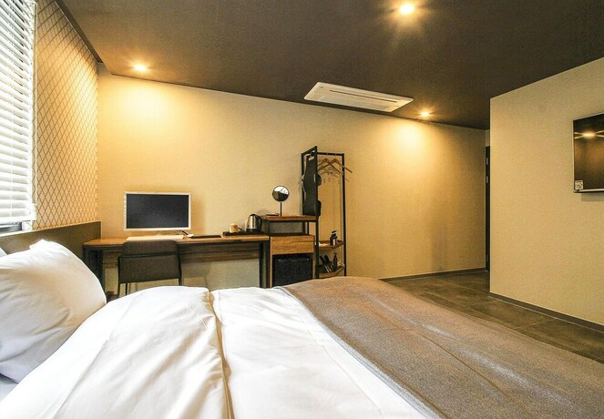 Imagen de la habitación del Hotel Brown Dot waterpark. Foto 16
