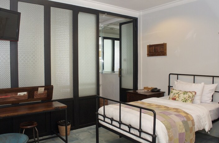 Imagen de la habitación del Hotel Brown Feather. Foto 17