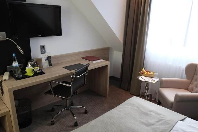 Imagen de la habitación del Hotel Brunnenhof International. Foto 10