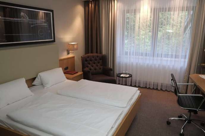 Imagen de la habitación del Hotel Brunnenhof International. Foto 12