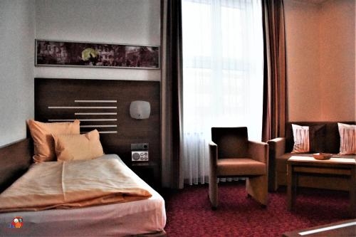 Imagen de la habitación del Hotel Br&uuml;hlerh&ouml;he Erfurt. Foto 8
