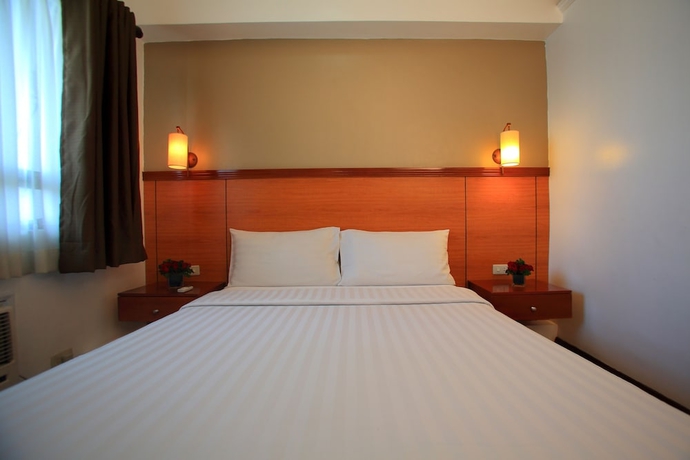 Imagen de la habitación del Hotel Bsa Suites Makati. Foto 14
