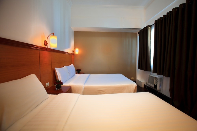 Imagen de la habitación del Hotel Bsa Suites Makati. Foto 16