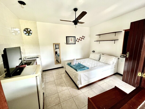 Imagen de la habitación del Hotel B&uacute;zios Flat Pousada. Foto 15