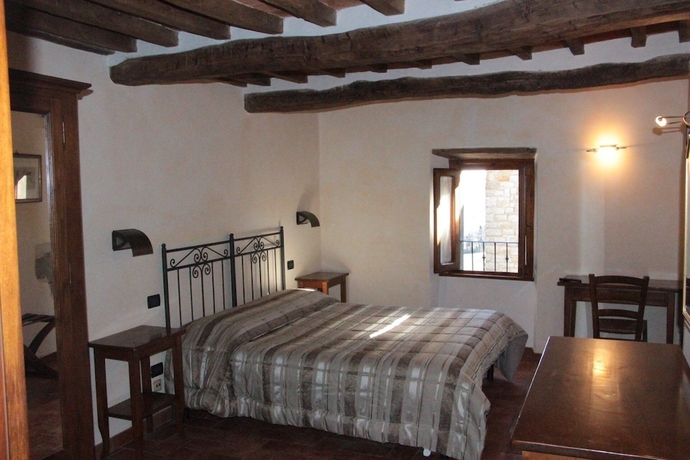 Imagen de la habitación del Hotel Buca Di Michelangelo. Foto 9
