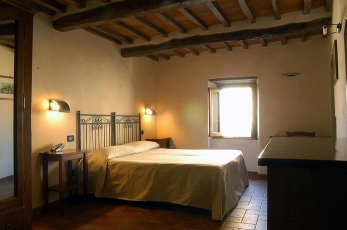 Imagen de la habitación del Hotel Buca Di Michelangelo. Foto 13
