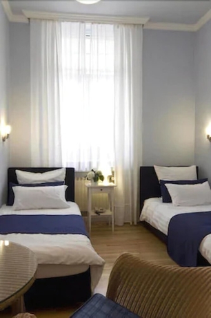 Imagen de la habitación del Hotel Buchholz Downtown. Foto 12