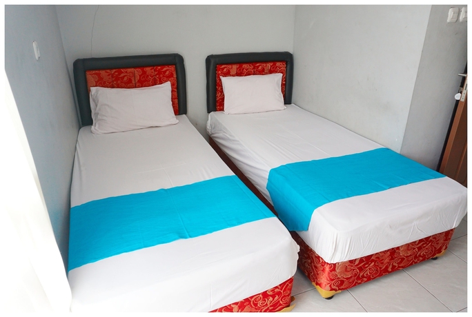 Imagen de la habitación del Hotel Budi House and Food Station. Foto 11