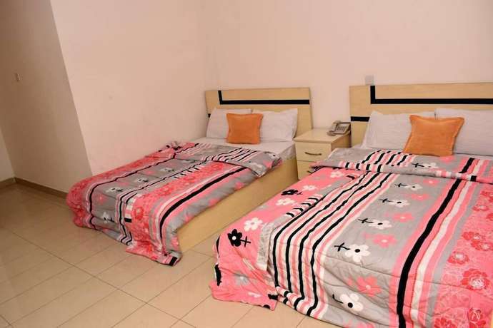 Imagen de la habitación del Hotel Buggatti and Suites. Foto 12