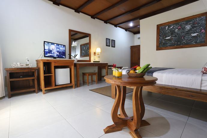 Imagen de la habitación del Hotel Bumi Ayu Bungalows. Foto 2