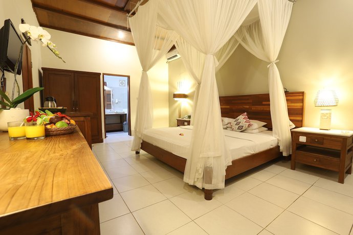 Imagen de la habitación del Hotel Bumi Ayu Bungalows. Foto 5