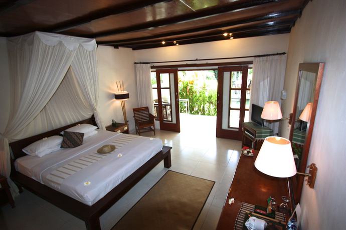 Imagen de la habitación del Hotel Bumi Ayu Bungalows. Foto 7