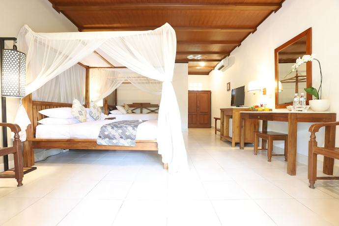 Imagen de la habitación del Hotel Bumi Ayu Bungalows. Foto 8