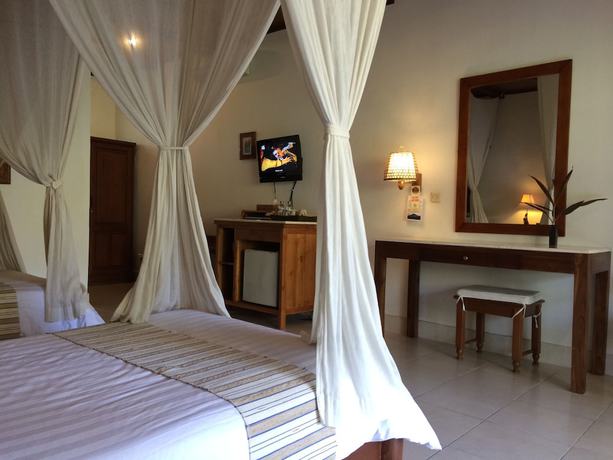 Imagen de la habitación del Hotel Bumi Ayu Bungalows. Foto 10