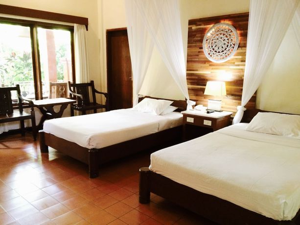 Imagen de la habitación del Hotel Bumi Ayu Bungalows. Foto 13