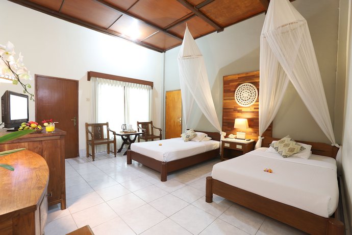 Imagen de la habitación del Hotel Bumi Ayu Bungalows. Foto 15