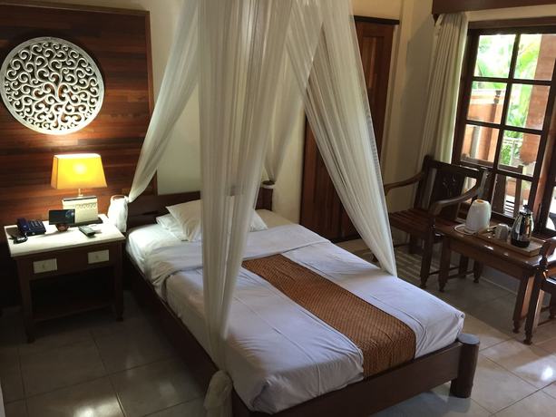 Imagen de la habitación del Hotel Bumi Ayu Bungalows. Foto 16