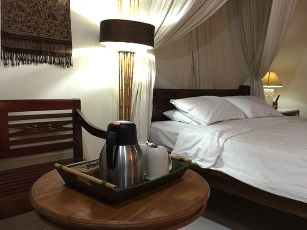Imagen de la habitación del Hotel Bumi Ayu Bungalows. Foto 17
