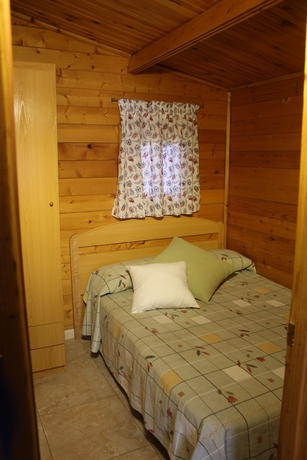 Imagen de la habitación del Hotel Bungalows Oasis. Foto 7