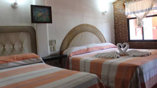 Imagen de la habitación del Hotel Bungalows Y Caba&ntilde;as Acuario. Foto 6