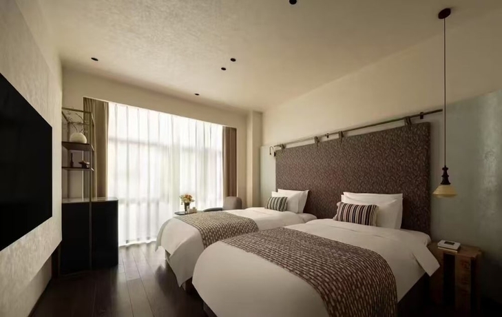 Imagen de la habitación del Hotel Buqi hotel. Foto 4