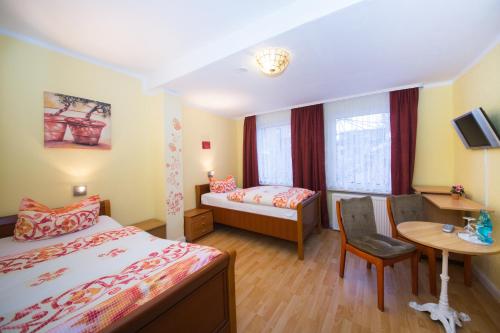 Imagen de la habitación del Hotel Busch in Wilster. Foto 5