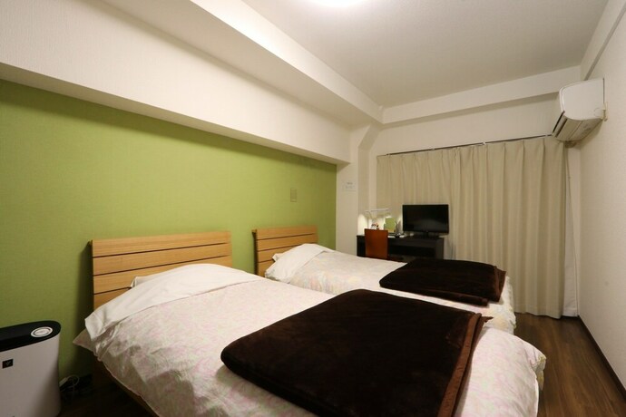 Imagen de la habitación del Hotel Business Inn Grandeur Fuchu. Foto 2