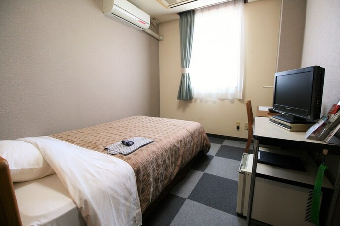 Imagen de la habitación del Hotel Business Kohoku. Foto 10