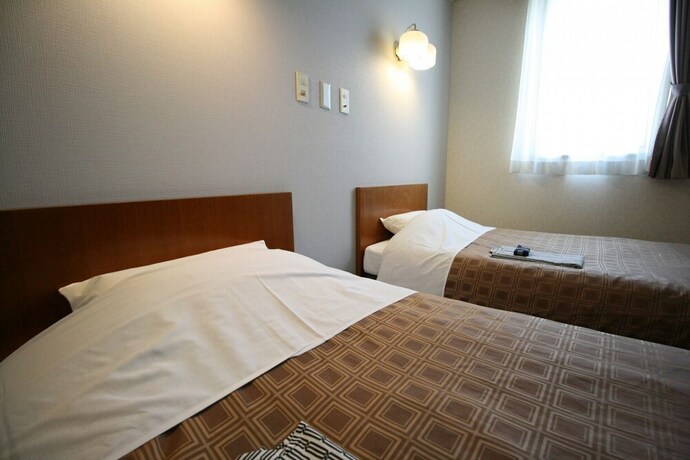 Imagen de la habitación del Hotel Business Kohoku. Foto 13