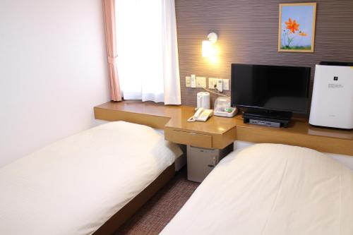 Imagen de la habitación del Hotel Business Raicho. Foto 3