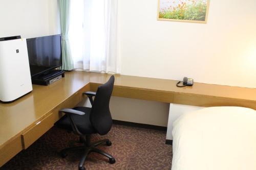 Imagen de la habitación del Hotel Business Raicho. Foto 4