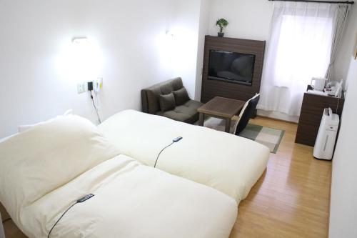 Imagen de la habitación del Hotel Business Raicho. Foto 5